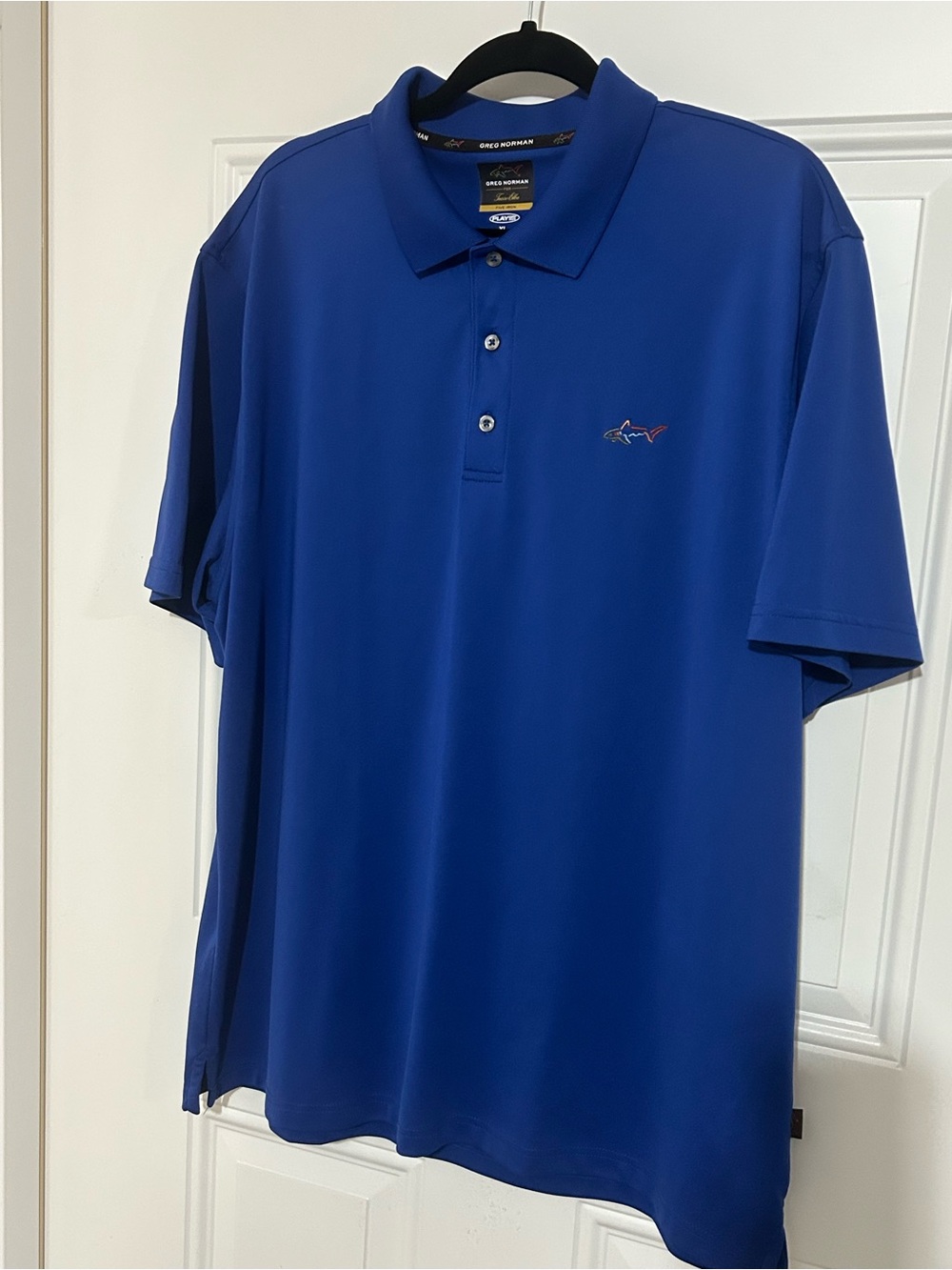 Greg Norman Tasso Elba Blue Short Sleeve Polo with Shark Accent